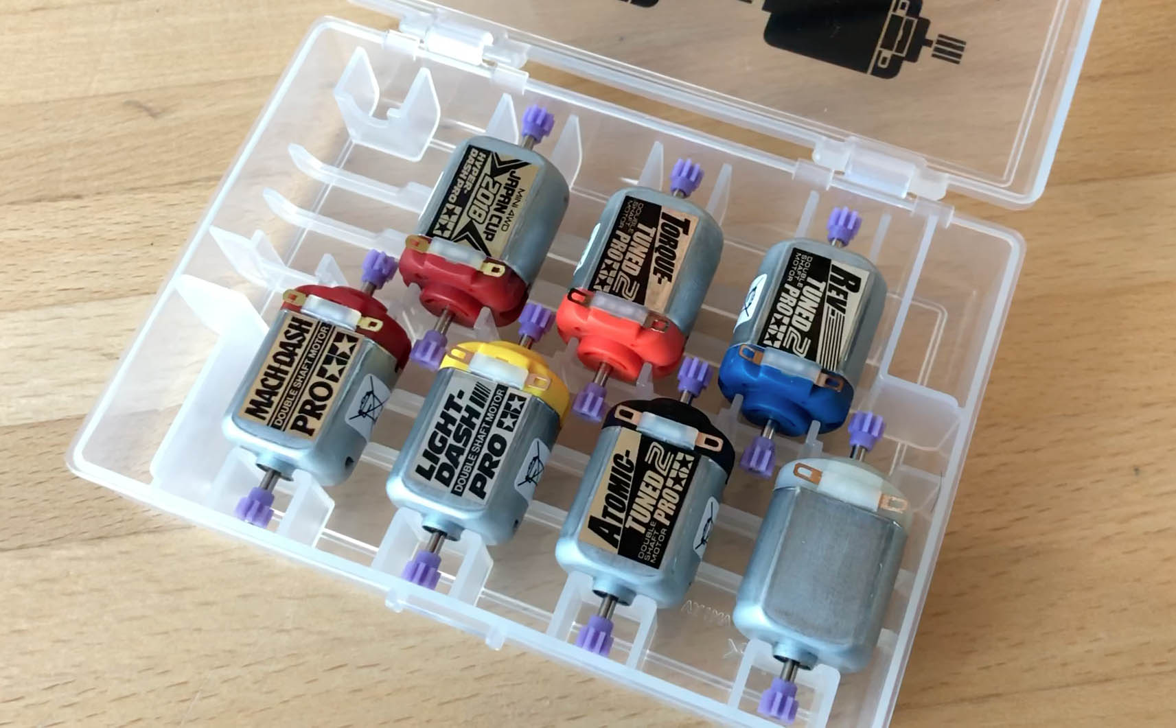 Tamiya Mini 4WD PRO Motors in a motor case (Stock PRO, Rev-Tuned PRO, Atomic-Tuned PRO, Torque-Tuned PRO, Light-Dash PRO, Hyper-Dash PRO and Mach-Dash PRO)